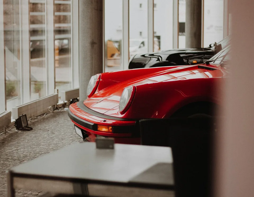 red convertible parked inside garage